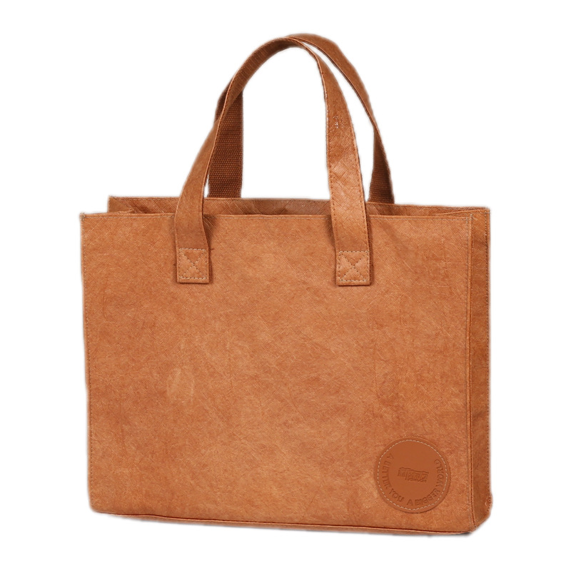 Bolsas de papel DuPont retro personalizadas para salir bolsa de compras kraft impermeable impresión LOGO de hombro único bolsas de papel DuPont