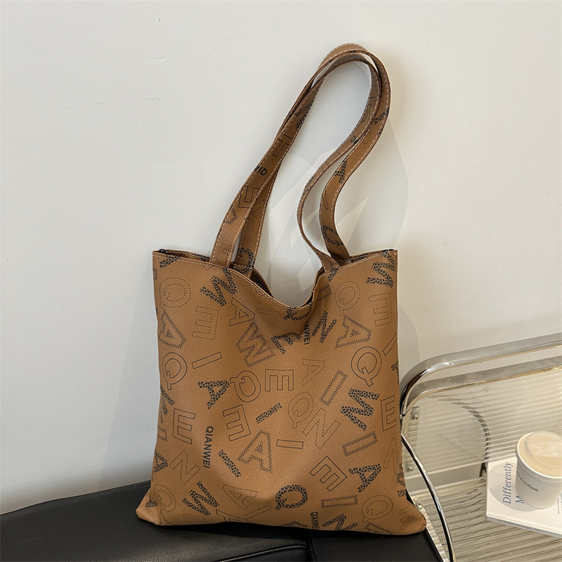 Bolso de mano otoño y invierno nuevo estilo de moda letras impresión bolso de mujer textura bolso de hombro elegante bolso retro europeo y americano