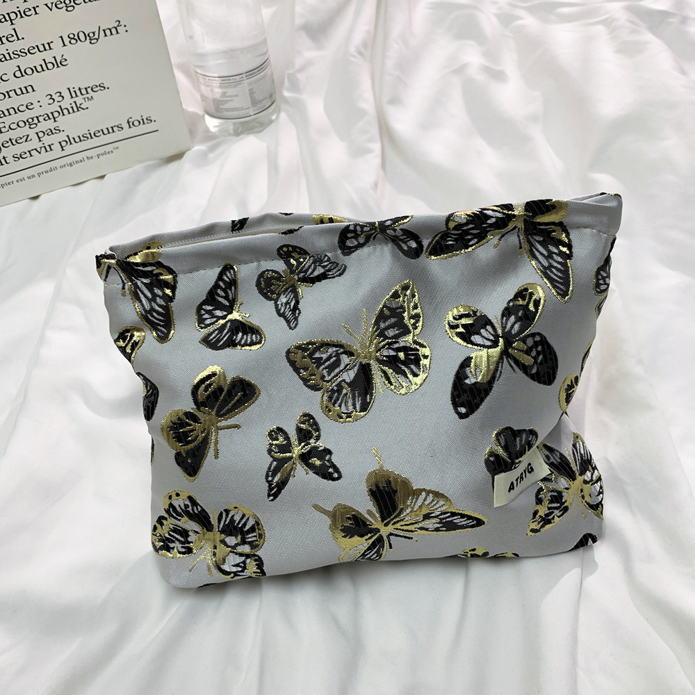 Bolsa de maquillaje mariposa tricolor negra