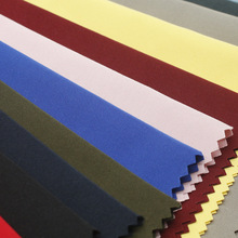 21S涤纶涤纱布料防水平纹秋冬羽绒服面料梭织化纤现货蜂窝帘仿棉