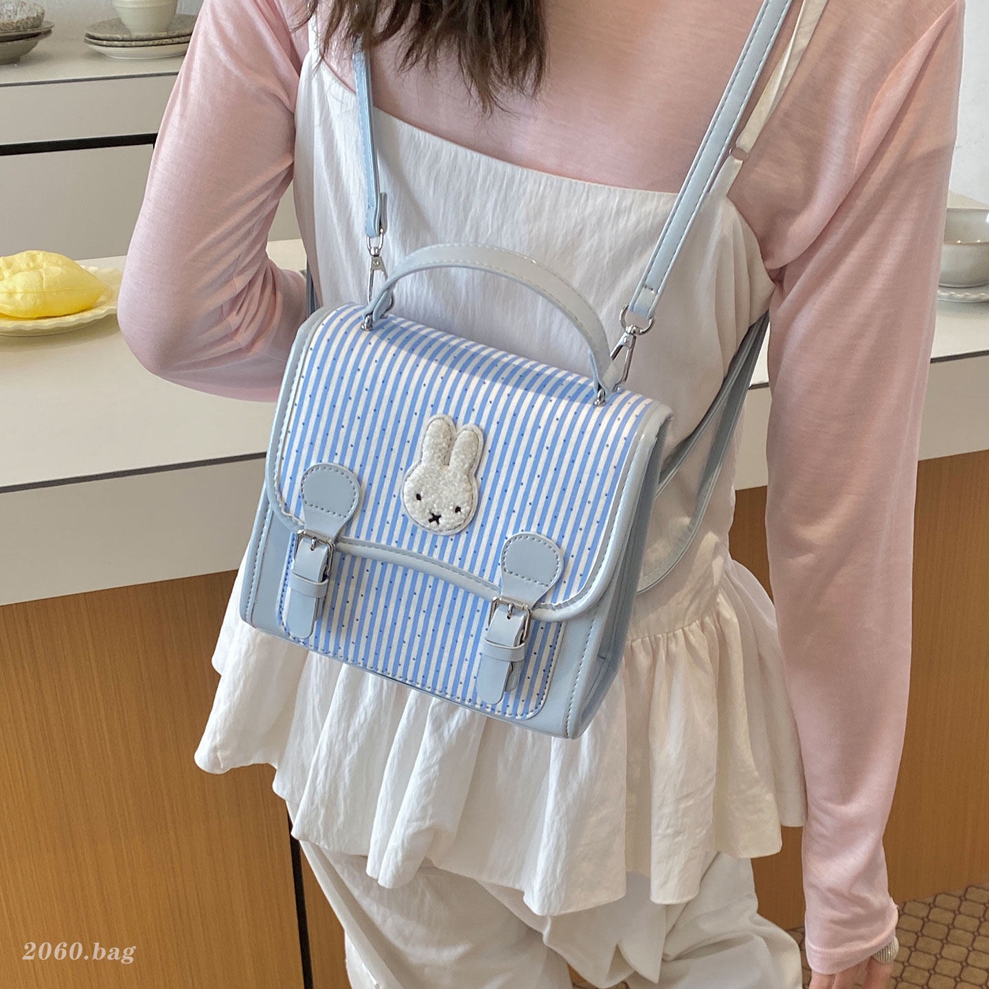 Caricatura de dibujos animados estilo nuevo diseño estilo mochila universidad flip mochila de nicho de moda 2026 rayas para mujeres