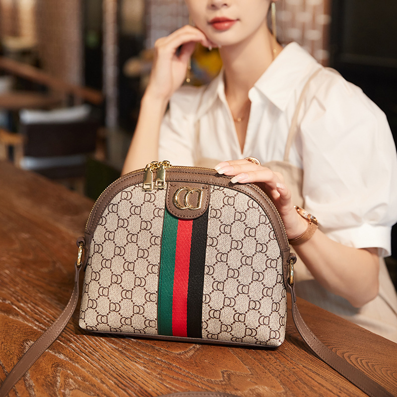 Bolso de concha para mujer 2025 nuevo bolso de primavera y verano moda de alta gama con cinta de un solo hombro bolso bandolera.