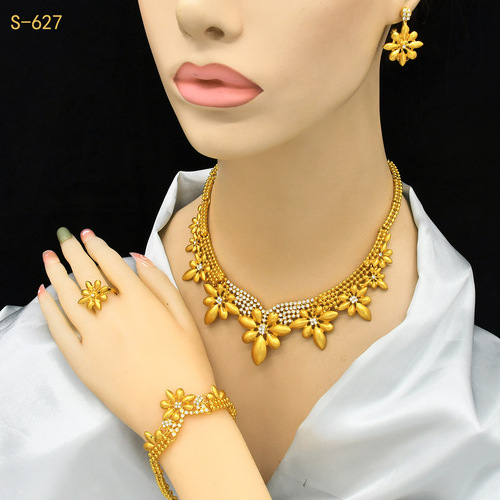 Gold-plated jewelry set for Nigerian bride, featuring an exaggerated flower-themed long necklace, ring, bracelet, and earrings set of four