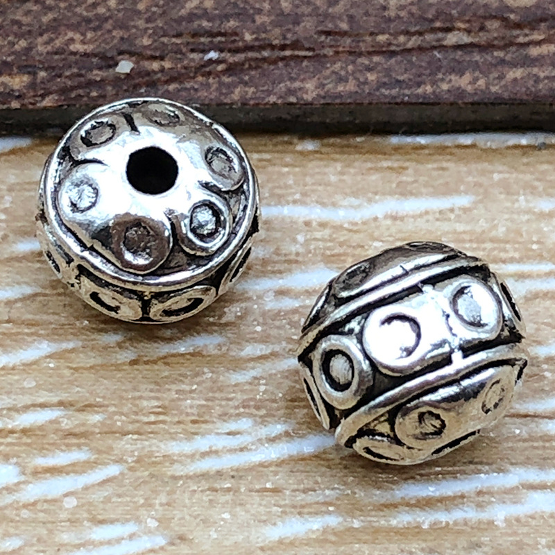 16463-古银圆形间隔珠7x8-孔1.7-1.3g华亿.j