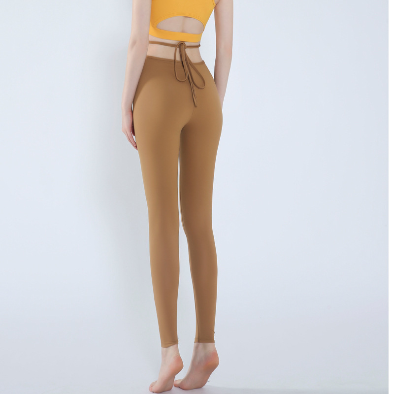 Pantalones de yoga para mujer 2021 Nuevos pantalones cortos ajustados con cordones de cintura alta desnuda corriendo baile de secado rápido pantalones de fitness elásticos altos