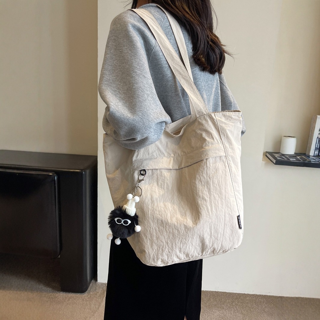 2025新款簡約大容量尼龍布包包女時尚單肩托特包高級感純色通勤包