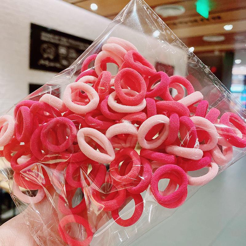 Banda de goma de bebé Corea del Sur banda de pelo de los niños anillo de toalla de color caramelo bolsa de Margarita banda de pelo OPP bolsa cuerda de pelo banda de goma al por mayor