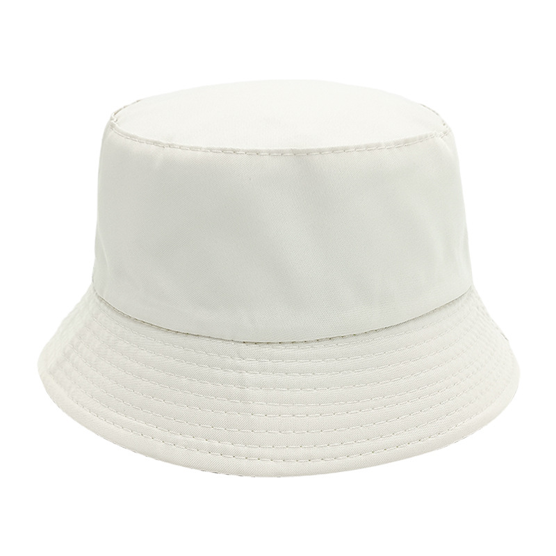 Productos de puestos de tierra Sombrero de pescador de color sólido barato Sombrero de camuflaje de protección solar de doble cara personalizado Sombrero de publicidad de viajes de tablero de luz al por mayor