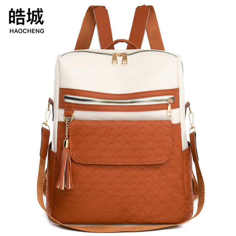 Mochila de cuero suave de color de contraste para mujer nueva transfronteriza Mochila de computadora de gran capacidad tejida de moda Mochila de mochila multiusos