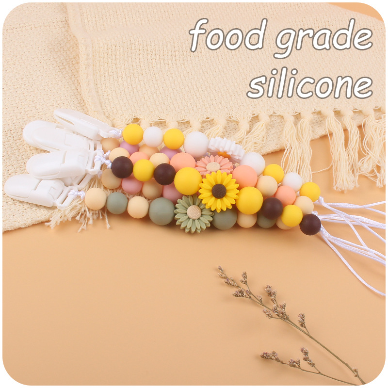 Suministros para bebés de dibujos animados flor mordedor calmante bebé de silicona mordedura pegamento molar Cadena de pezón cadena anti-caída Nuevo