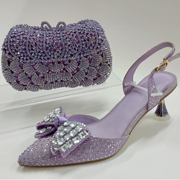 Fashionable high heels with bow for bride with a strap