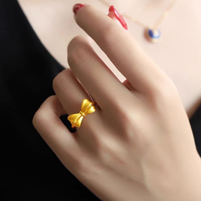 蝶結びの指輪の女性は黄金色の開口部をめっきして、口の麻の花の尾戒の指輪のシンプルなファッションの軽豪華さは色を落とさない。|undefined