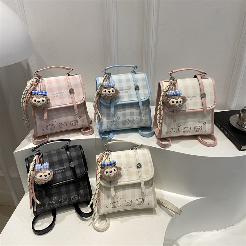 Modelo coreano de moda retro estriado mochila de hombro mujer2026 textura alta temperamento versátil mochila casual