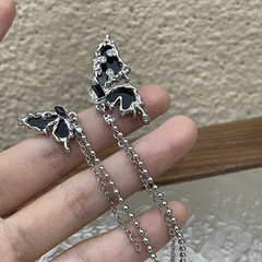 S925銀針非対称黒蝶翼イヤリング女性の新しい潮耳飾り小衆デザイン流蘇ピアス潮