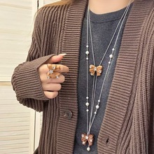 超闪锆石花朵蝴蝶结戒指项链女2025冬季新款小众轻奢百搭长款毛衣