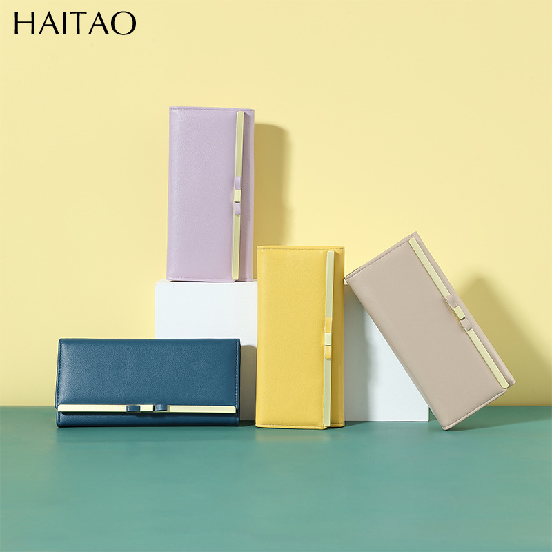 Nueva cartera larga para mujer, bolso de mano tipo clutch de color sólido de alta gama, cartera de cuero genuino al por mayor.