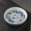 Under blue and white glaze, dragon and phoenix form auspicious pot holder