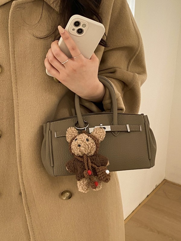 Bolso de nicho coreano nuevo producto de alto nivel lichi estampado bolso de mano Kelly de moda correa de pulsación de hebilla universal mochila