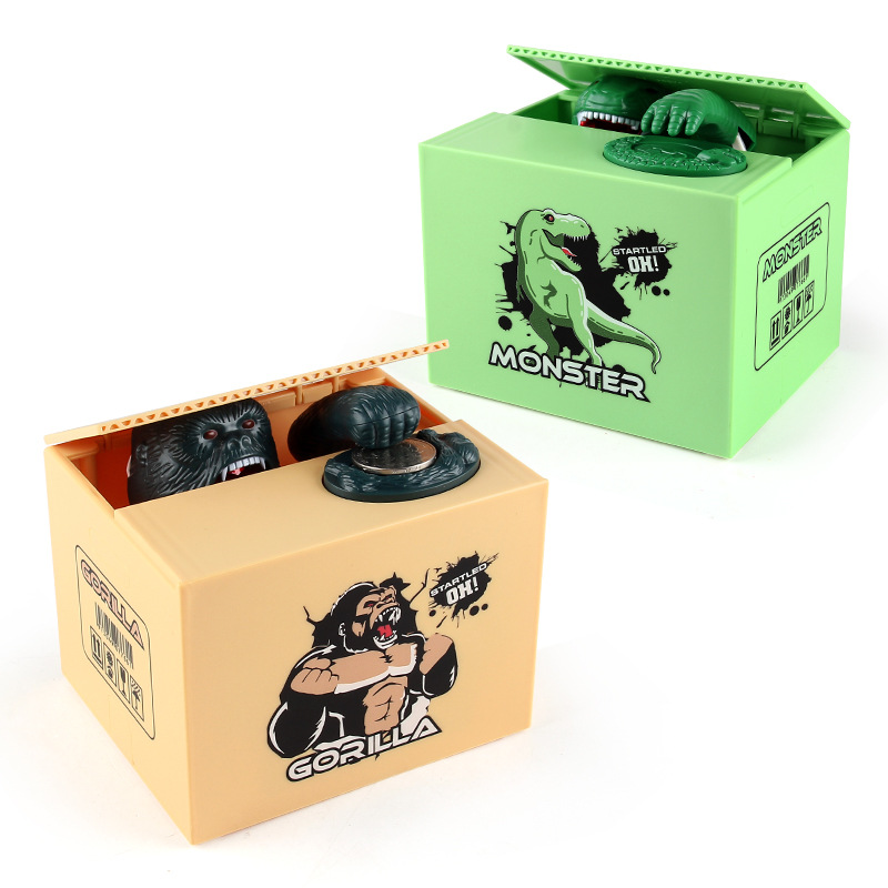 Juguetes de ocio para niños dibujos animados eléctricos robar dinero dinosaurio fruta caja moneda hucha comer dinero orangután hucha