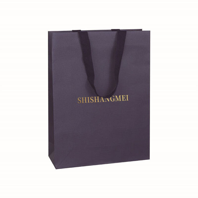 High-quality navy blue textured paper bag with custom gold-stamped logo, luxurious specialty paper shopping bag for clothing and jewelry
