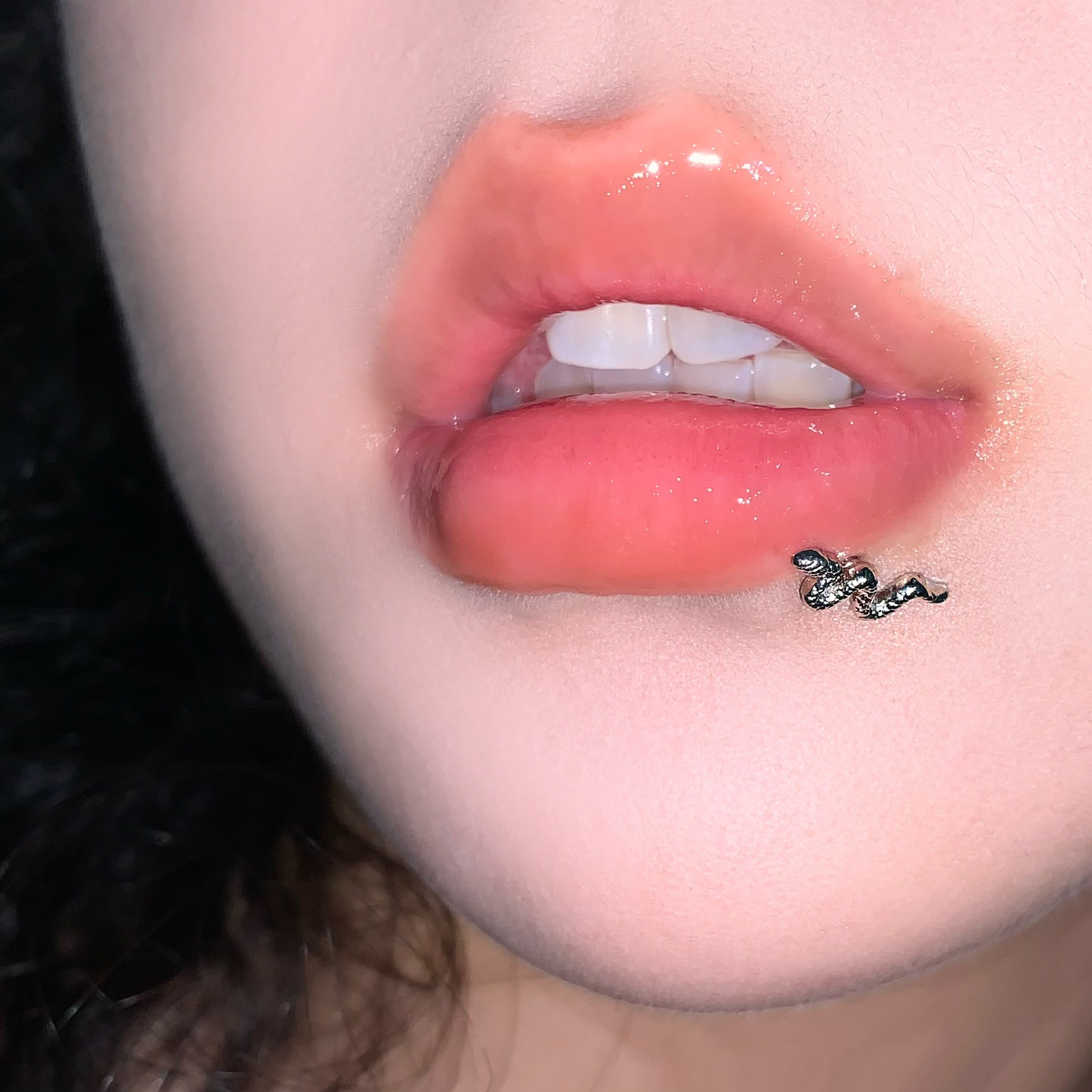Silver pointed spike labret stud material detail
