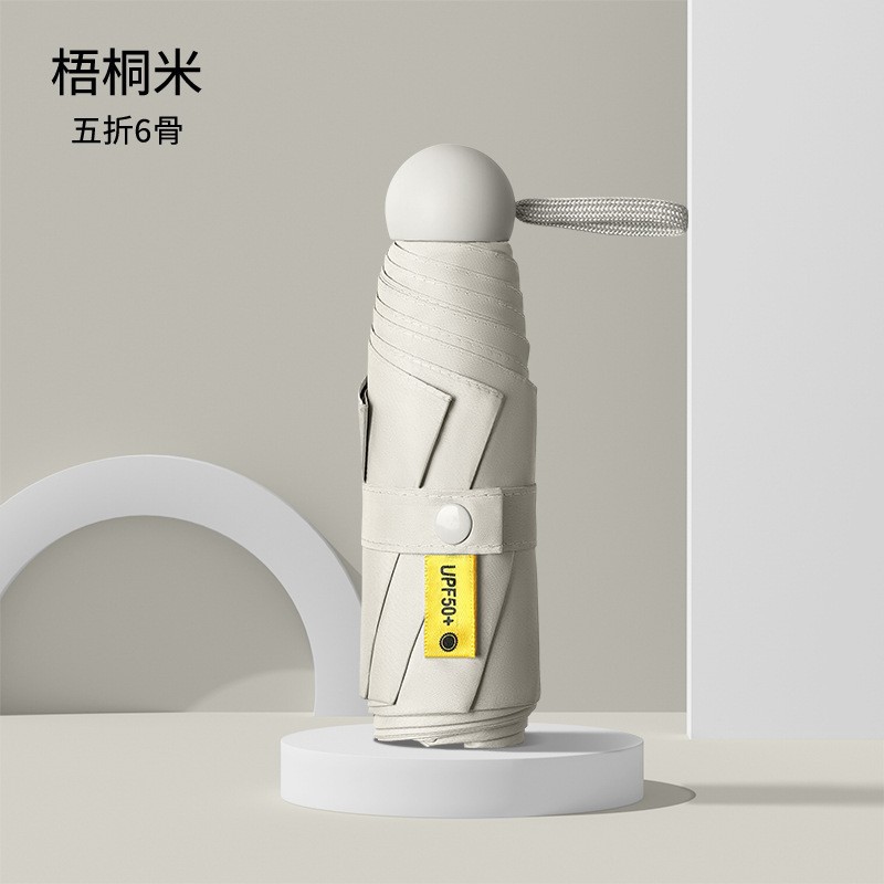 Cincuenta plegables mini cápsula soleado y lluvia para mujeres paraguas de sol de bolsillo de vinilo ultraligero compacto y portátil