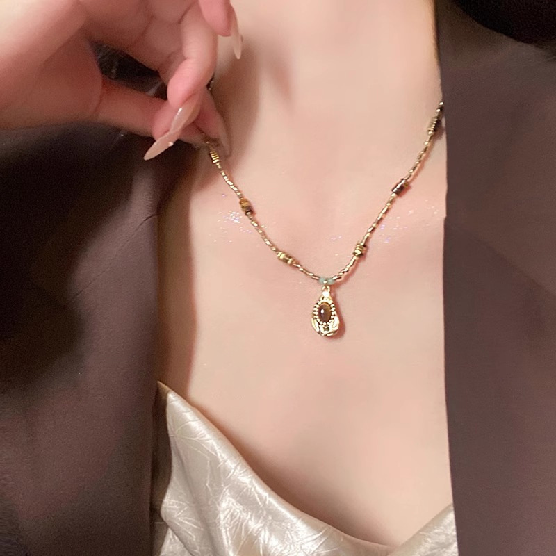 ファッションフォーカス！不規則なタイガーアイストーンのネックレスは、ユニークな魅力を示し、絶妙なスタイルと魅力を表現します。|undefined