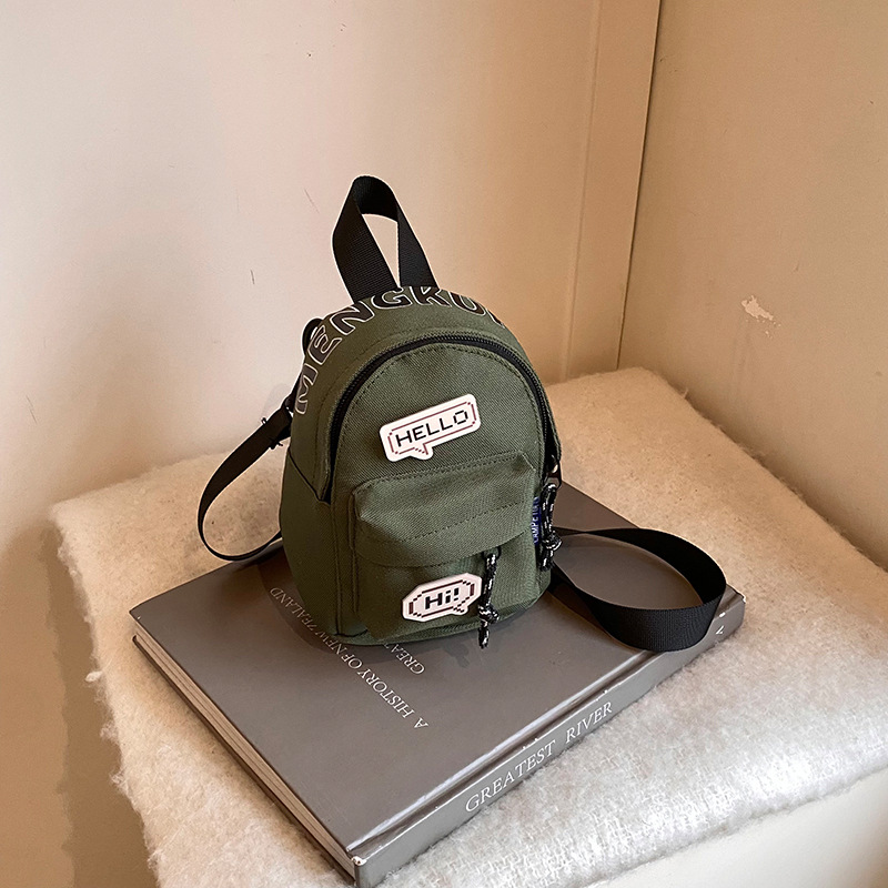 Mini bolso coreano para niños y niñas, letras extranjeras, insignia para bebés, bolso de cambio 2025, nuevo bolso para niños de comercio exterior