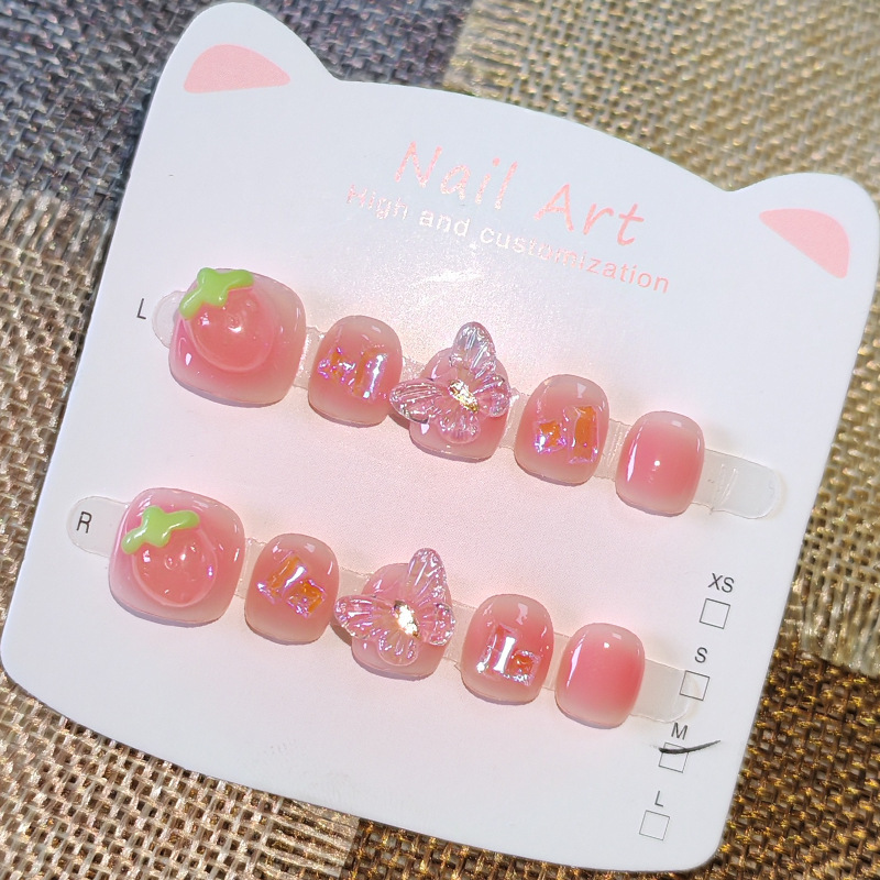 Pink translucent strawberry children's press-on nails for ages 3-6-12, transparent 3D butterfly handmade nail art wholesale, ins style Pink translucent strawberry children's press-on nails for ages 3-6-12, transparent 3D butterfly handmade nail art wholesale, ins style