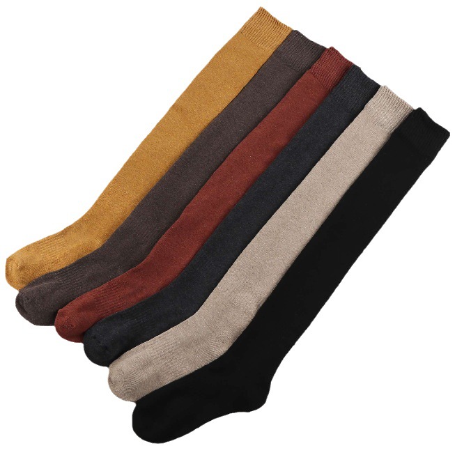 Zhuji calcetines de otoño e invierno al por mayor de las mujeres medias de invierno cálido color sólido forrado de lana gruesa larga Terry sobre la rodilla Calcetines