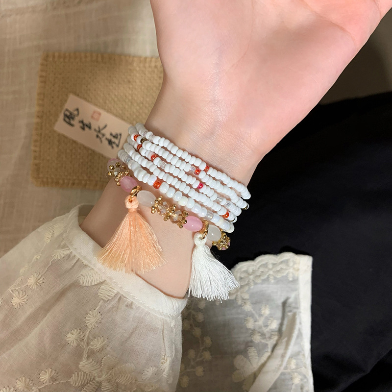 Brazalete con cuentas multicapa de cuentas de mijo de estilo bohemio para niñas, estilo étnico de verano, lujo ligero, joyería de mano retro de nicho