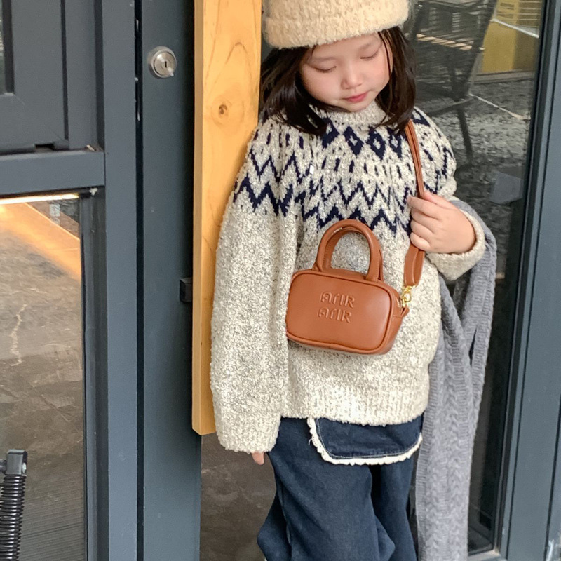 2025 nuevo bolso infantil coreano simple color sólido letras extranjeras bolso bebé mini bolso de bolos para niños