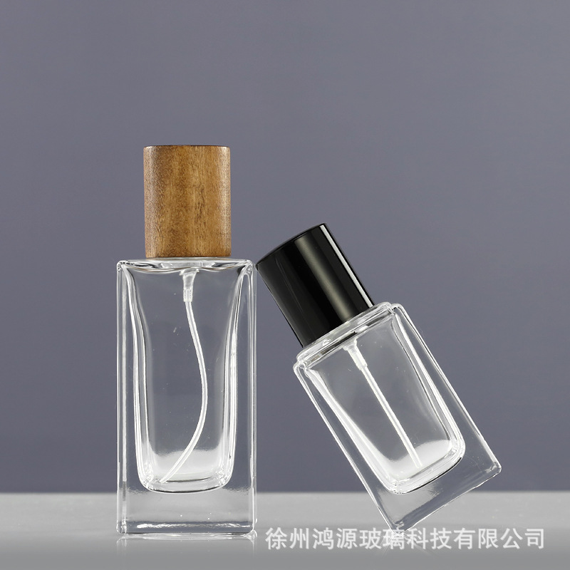 Perfume al por mayor botella de vidrio 30ml50ml botella de bayoneta cuadrada vintage Lotus cubierta de madera aerosol fino sub-botella portátil