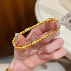 金店の同モデルはベトナムの砂金にジルコンの金の玉を入れてずっしりとしています。