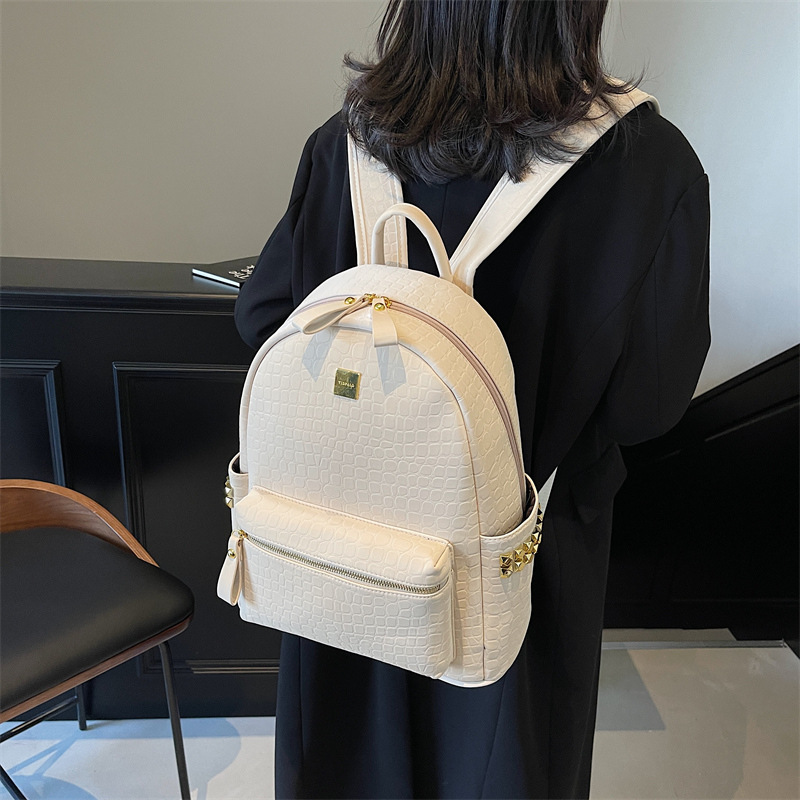 Mochila de viajes de gran capacidad de aire extranjero 2025 nueva mochila de mujer transfronteriza popular mochila de estudiantes universitarios con patrón de piedra