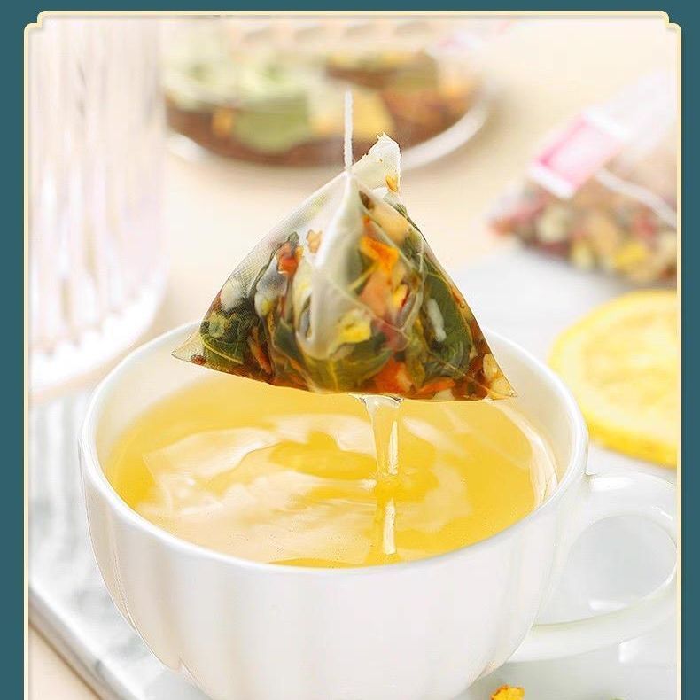 Dark Plum and Lotus Leaf Tea Wumei He Ye Yin 150g 30 Triangle Tea Bags Summer Herbal Drink in use