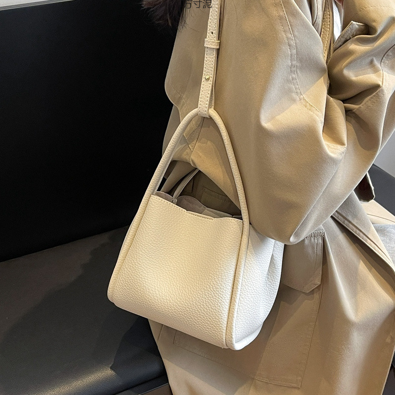 子供の母のハンドバッグの女性の高級感insの小さな野菜のかごは純色のバケツのバッグの斜めのショルダーバッグ2025の新型を包みます。