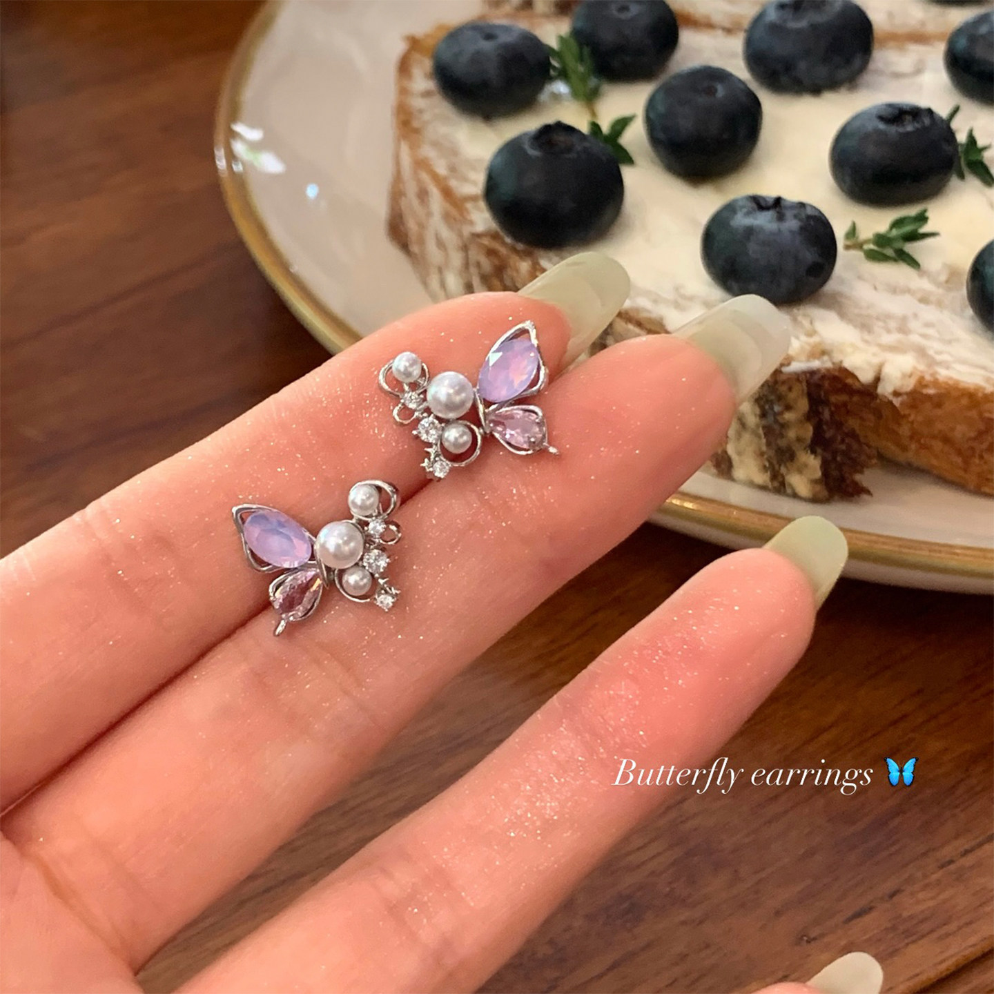 S925 aguja de plata Sen pequeñas flores frescas pendientes de orejas de vacaciones mujeres lujo ligero nicho alta sensación pendientes de perlas