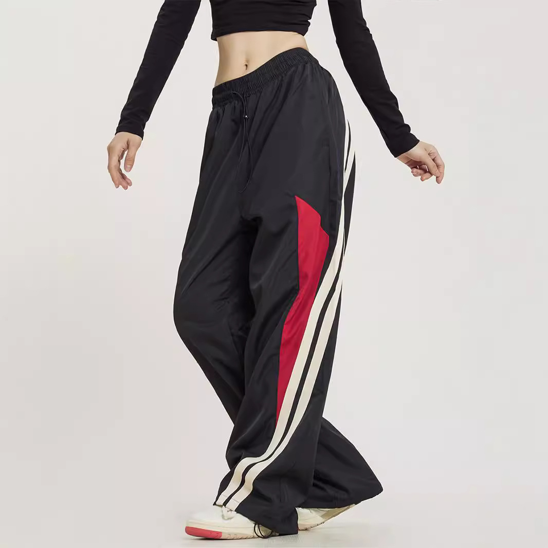 Pantalones deportivos a juego con rayas laterales de baile callejero retro americano para hombres y mujeres pantalones anchos sueltos rectos de primavera y otoño