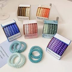 6本のグラデーションの色の箱の電話線の髪の輪がないです。