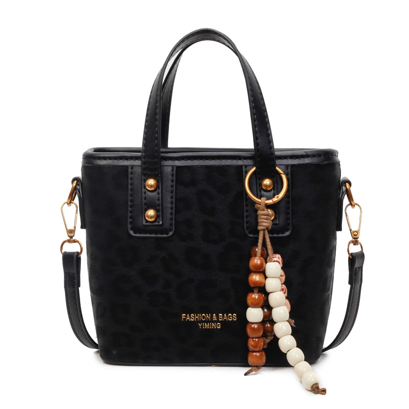 Bolsa de mano con patrón de leopardo transfronterizo, bolsa de cubo de viaje, mujer, otoño y invierno 2025, nueva moda, bolso de hombro de estilo extranjero.