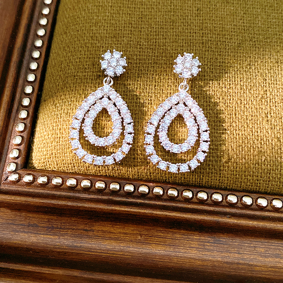 18k oro real chapado aguja de plata de piedra de silicio gota de agua personalidad temperamento pendientes de moda ligero lujo alta sensación de auriculares