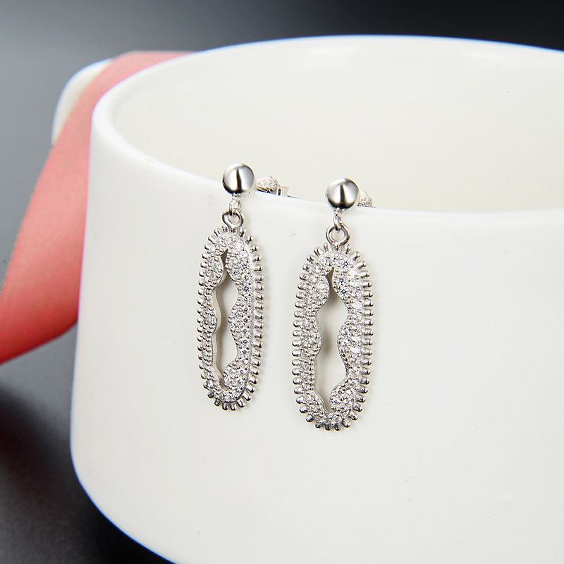 Joyas de moda europeas y estadounidenses de comercio exterior 925 plata esterlina damas geométrica exagerada hueco pendientes de zircón largos pernos