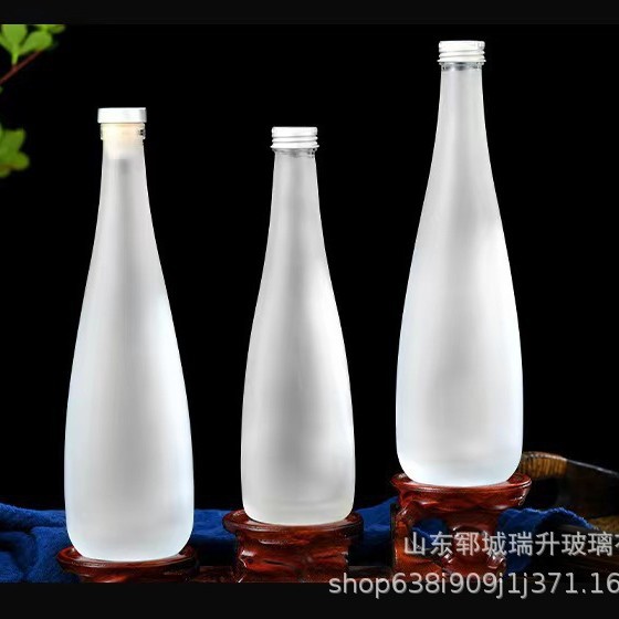 厂家批发依云矿泉水瓶玻璃瓶 330ml500m新款l透明磨砂玻璃饮料瓶