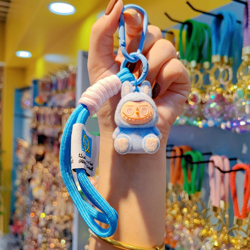 Caricatura floc amarelis llavero de automóvil pareja colgante bolsos creativos colgar garra máquina regalos al por mayor