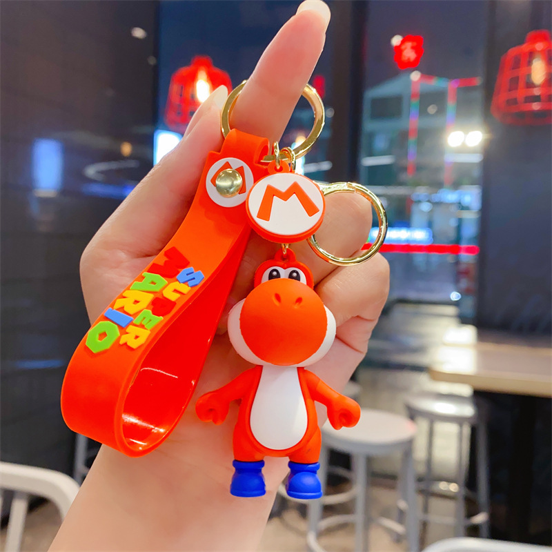 かわいい泡竜の小さい恐竜のキーホルダーの自動車のカップルの学生のリュックサックのペンダントの地は小さい贈り物の卸売りを押します。|undefined