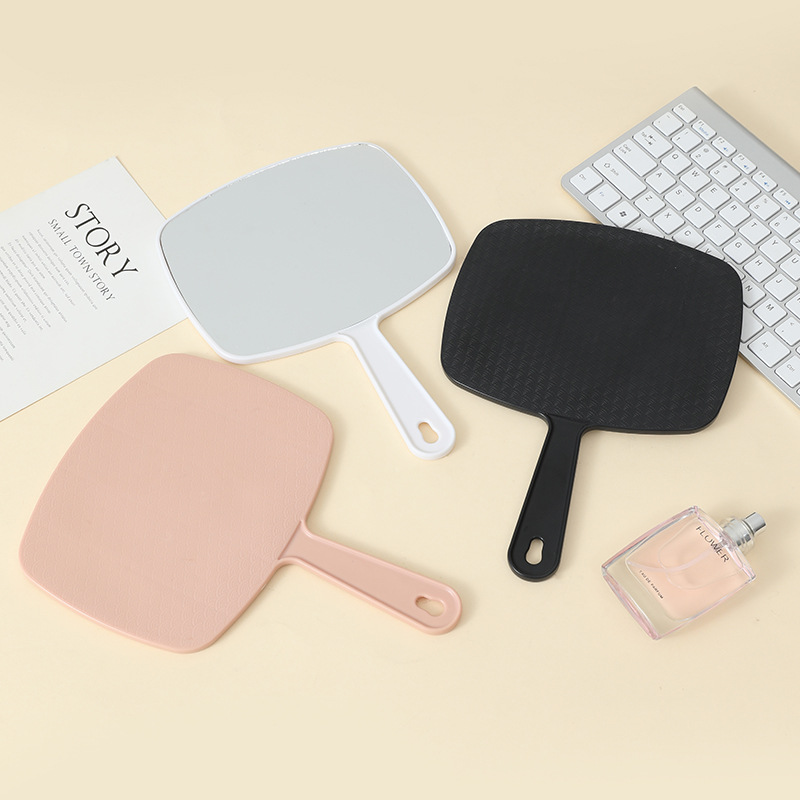 Espejo de maquillaje portátil de gran tamaño multifuncional colgante color sólido HD belleza mango espejo fábrica al por mayor