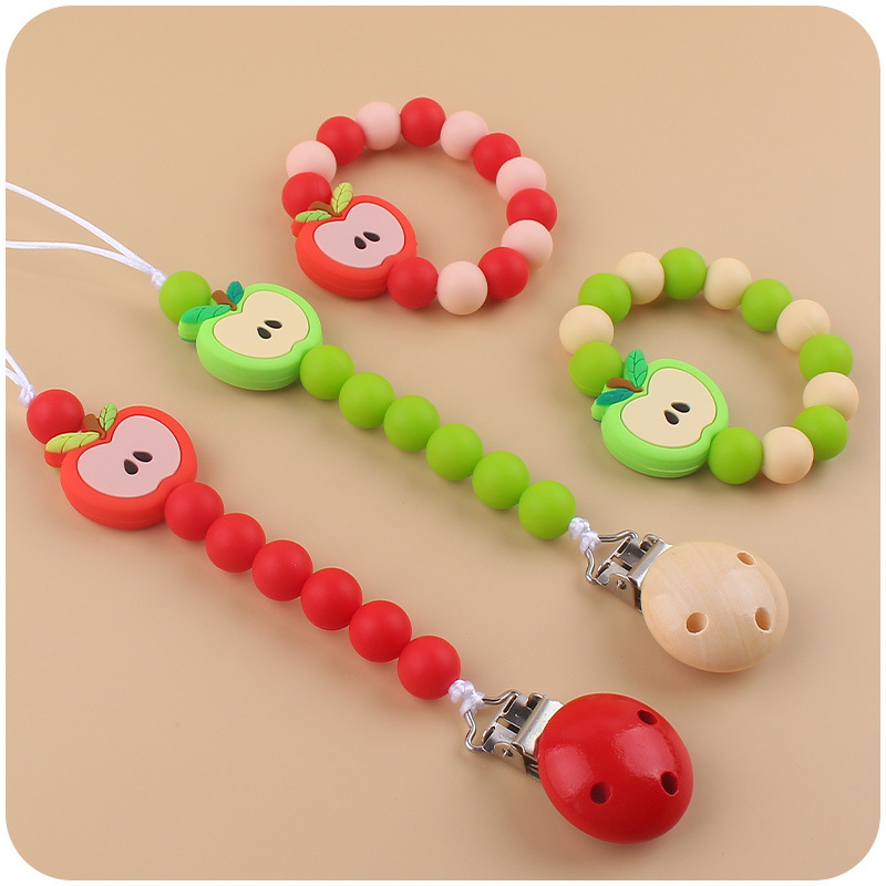 Nuevo bebé dibujos animados silicona Apple chupete cadena calmante bebé silicona mordedor pulsera juguete conjunto de dos piezas