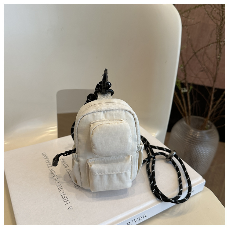 Mini colgante bolso de cambio 2025 nuevo cross-border nylon impermeable bolso de auriculares de bolsillo de hombro
