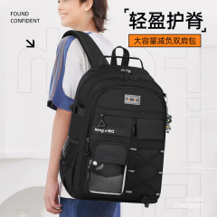 メーカーの新しい中学生向けバックパック、負担軽減脊椎保護スクールバッグ、女子高校生、大容量、メンズクロスボーダーバックパック、高級感